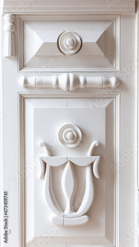 White antique wooden door with carved patterns