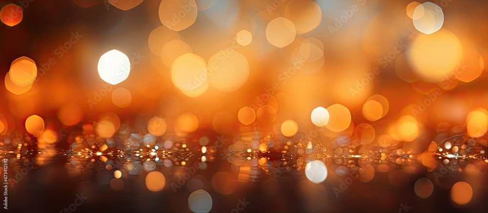 Blurred bokeh creates an abstract background with an orange hue Blurred bokeh creates an abstract background with an orange hue
