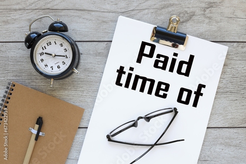 Wallpaper Mural paid time off. Business concept. text on white A4 paper on the desktop near the desk clock Torontodigital.ca