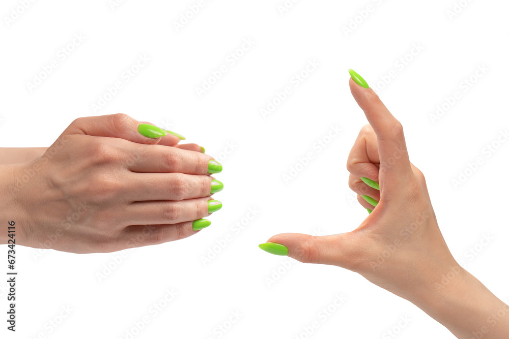 Hand of a woman with green naols hold some tiny or thin object. Hand of a woman with green naols hold some tiny or thin object.