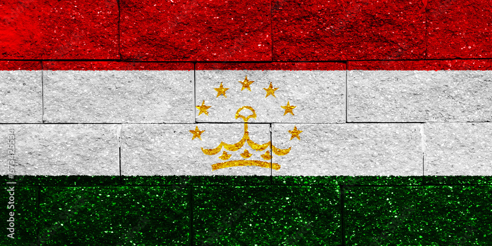 Flag of Republic of Tajikistan on a textured background. Concept collage.
