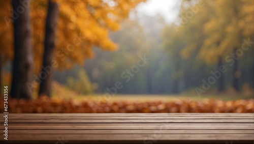 photo of an empty wooden table with a blurred autumn background  