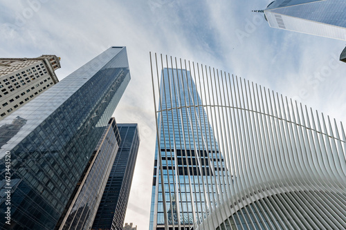 View from the bustling streets of Lower Manhattan  showcasing an iconic tower soaring into the cloud