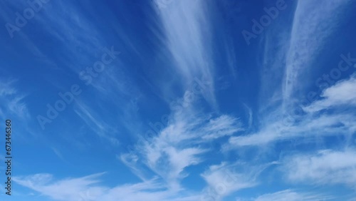 Cirrus clouds moving in the nice early sky photo