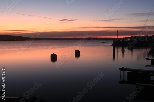 sunrise over calm water - Lysaker