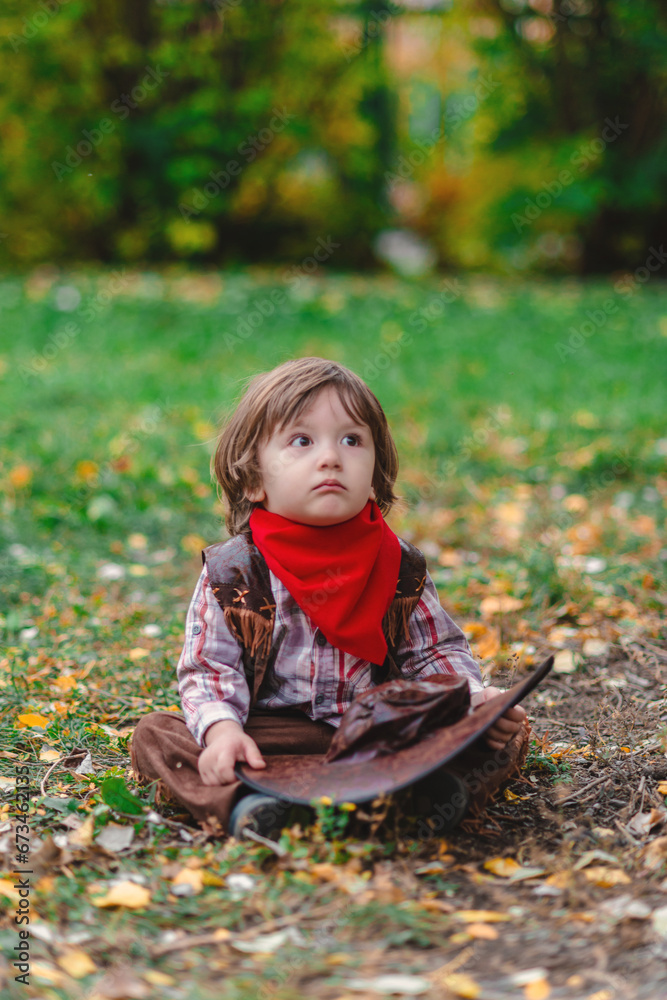 Little cowboy in the autumn field Little cowboy in the autumn field
