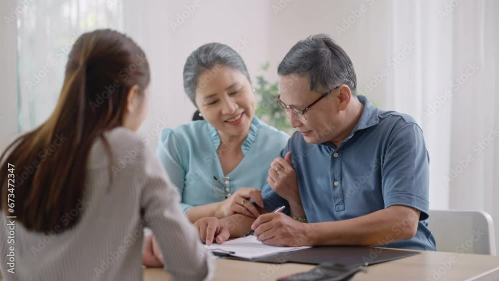 female realtor make property offer for sale to elderly spouses old customers contract on table,buy new home,take bank loan or medical health insurance concept.Financial advisor,realtor agent,insurance female realtor make property offer for sale to elderly spouses old customers contract on table,buy new home,take bank loan or medical health insurance concept.Financial advisor,realtor agent,insurance