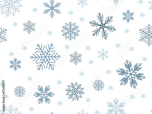 Blue Snowflakes of different sizes on white background. Seamless Pattern. Winter snowfall ornament. Falling snow