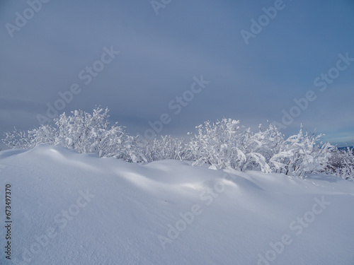 Fototapeta Naklejka Na Ścianę i Meble -  Snowdrifts on the top of the mountain.