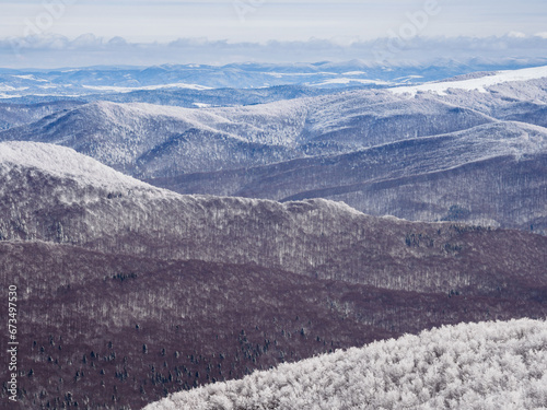 Fototapeta Naklejka Na Ścianę i Meble -  Winter mountain landscape. Mountain peaks covered with snow. View from Mala Rawka. Bieszczady Mountains. Poland