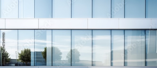 Detailed close up of the white cladding facade with rectangular windows and reflecting glass in a contemporary office building s corner