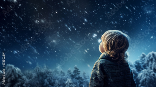 little boy under the starry sky photo