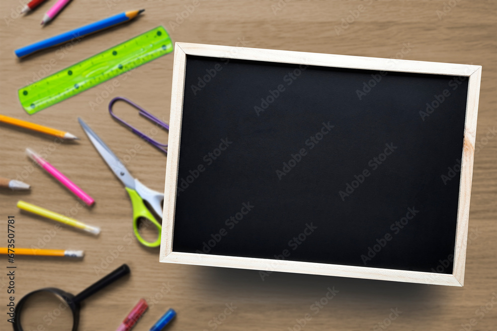 Template with copy space. School or business theme. Flat lay. Blank Chalkboard on background of desk with stationery. Place for text. Template with copy space. School or business theme. Flat lay. Blank Chalkboard on background of desk with stationery. Place for text.