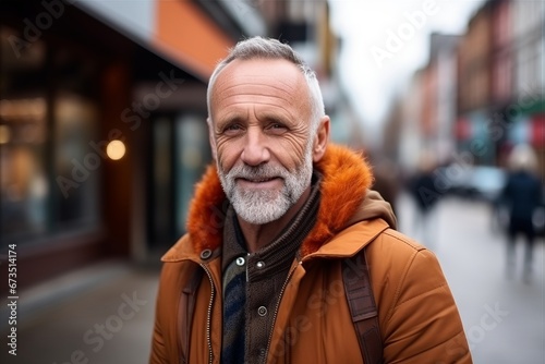 Portrait of a senior man with fur coat in the city.