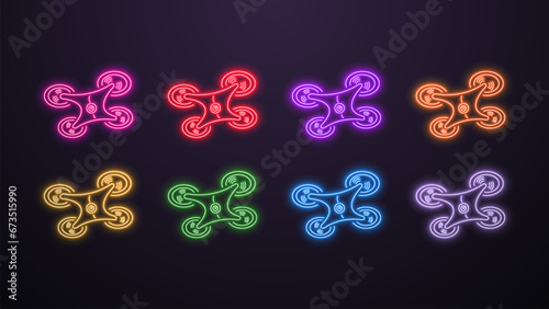 A set of neon shiny bright icons of drones and quadrocopters with artificial intelligence AI in different colors on a dark background.