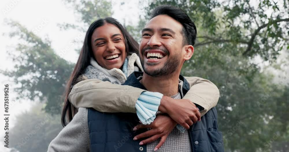 Love, couple and piggy back in the nature with a smile, happy date or people together for fun in the park, woods or walk in forest. Friends, Indian woman and man have quality time to play on vacation