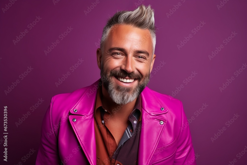Portrait of a handsome mature man in a pink leather jacket. Portrait of a handsome mature man in a pink leather jacket.