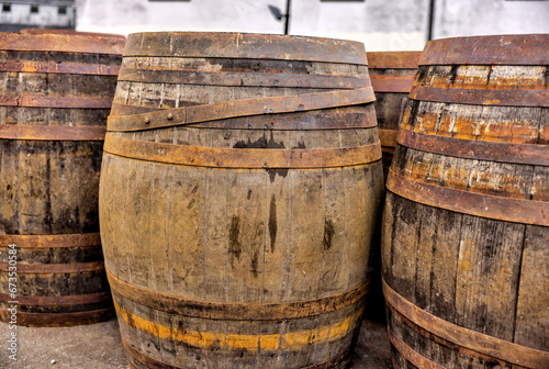 Dufftown Region, Scotland - September 23, 2023: Whiskey barrels being stored outside the Tomatin Whiskey Distillery in the region around Dufftown in Scotland

