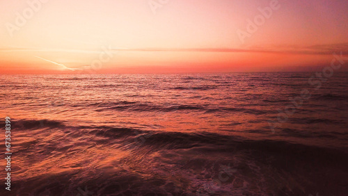 Aerial view of beach at sunset