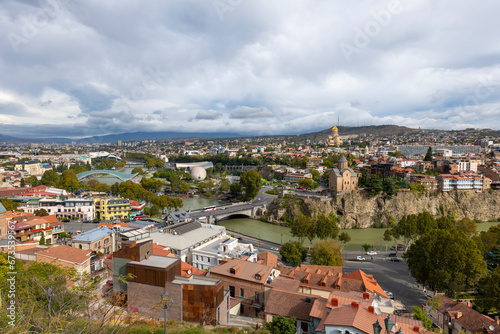 tbilisi city on a cloudy day and blue clouds in the sky © Aytug Bayer
