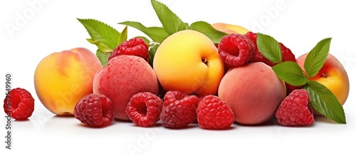 White background with ripe raspberries brambles and peaches separated