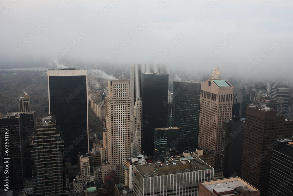 Manhattan in the fog from the height of a skyscraper.