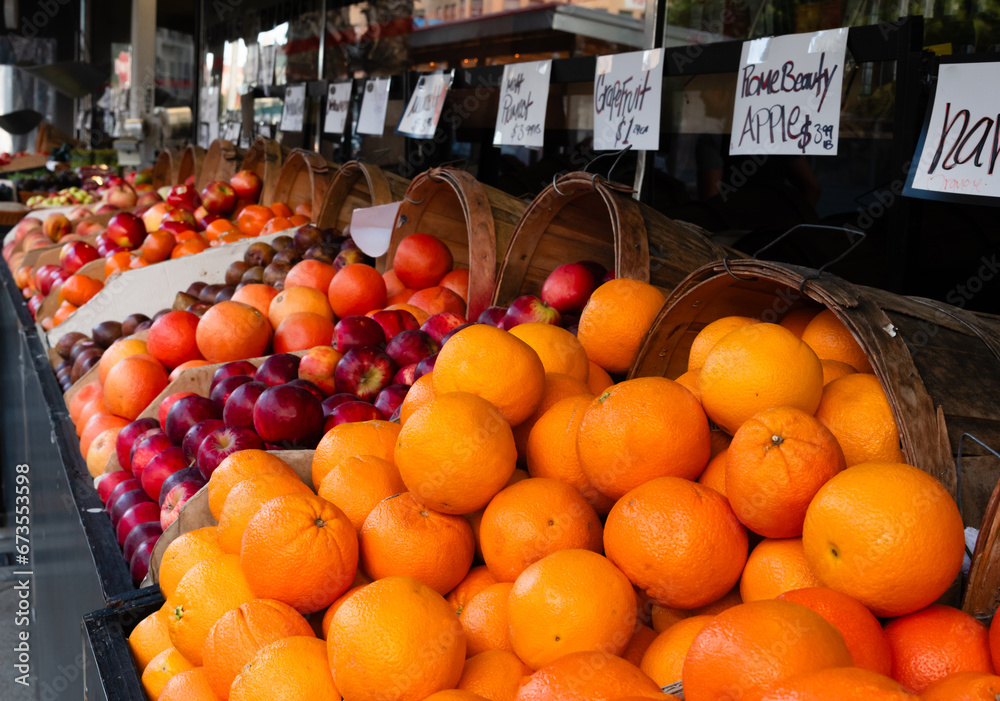 Baskets of apples and oranges at a produce stand in the Marina District of San Francisco, California