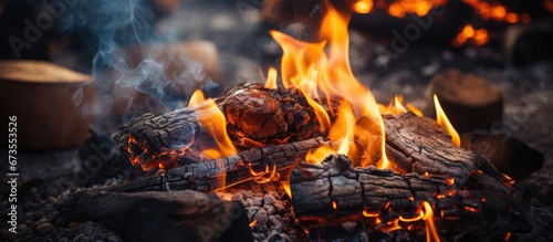 Barbecue using charred wood in an open air fire