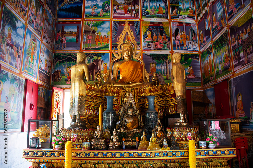 Naklejka premium Ancient buddha statue in antique ubosot hall for thai people travelers travel visit respect praying blessing wish holy mystery of Wat Muang temple at Angthong on October 31, 2023 in Ang Thong Thailand