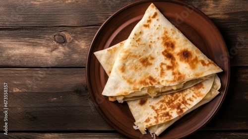 three quesadillas on top of a plate with sauce
