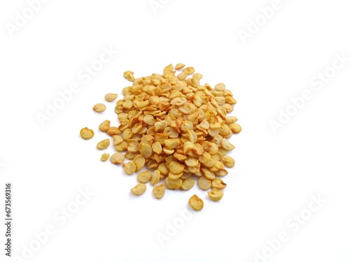 Cooking spice chili seeds on white background