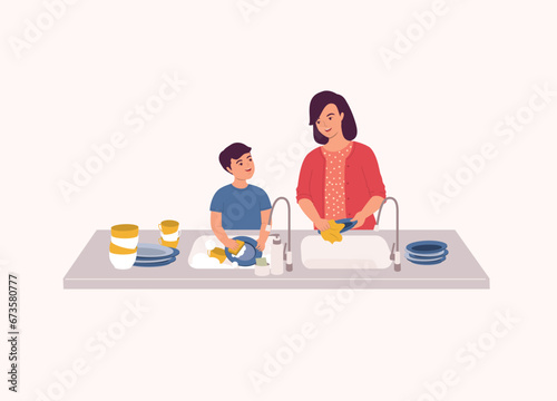 Happy Little Boy At Kitchen Sink Helping His Mother To Wash The Dishes. Half Length.