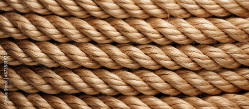 the detailed picture of a tangled rope made of natural fibers