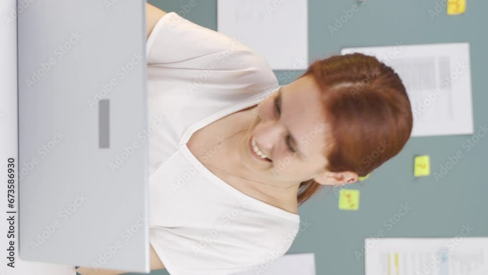 Vertical video of Woman chatting on laptop. Vertical video of Woman chatting on laptop.