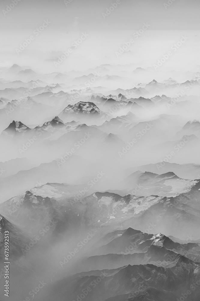 Morning fog covered Rocky mountains, aerial view Morning fog covered Rocky mountains, aerial view