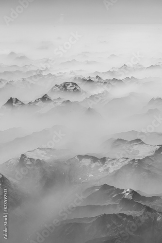Morning fog covered Rocky mountains, aerial view