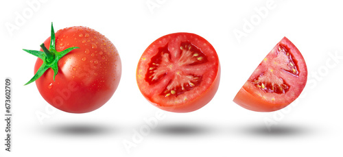 Flying tomato has water drop with half slices tomatoes and shadow isolated on white background.