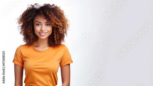 Afro american woman wearing orange t-shirt isolated on gray background