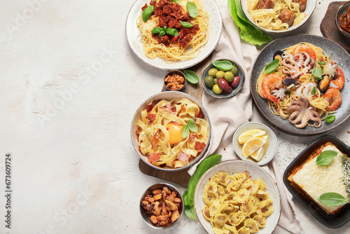 Assortment of Italian pasta dishes on light bachground. Traditional food concept.