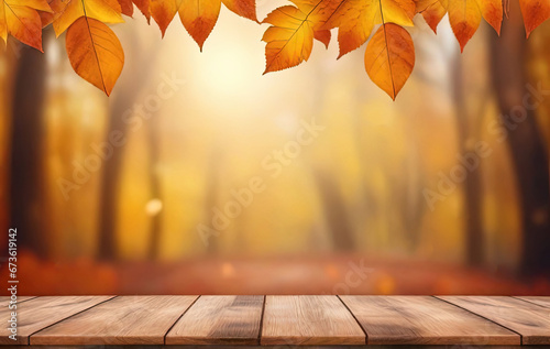 Empty wooden table with autumn background. Wooden table and autumn leaves on abstract bokeh fall background