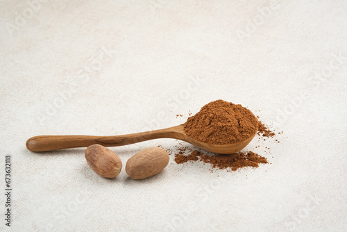 Pala Bubuk (Nutmeg Powder) on wooden spoon
 photo