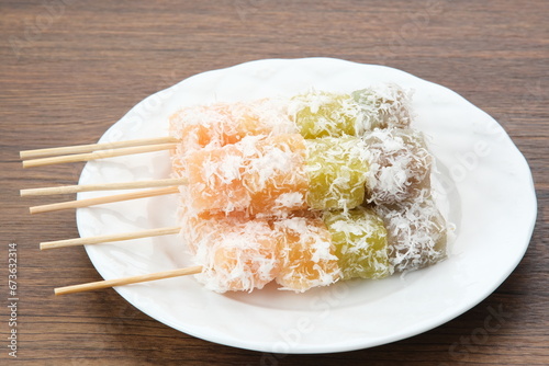 Sentiling or ongol-ongol, Indonesian traditional snack, made from cassava sprinkled with grated coconut
 photo