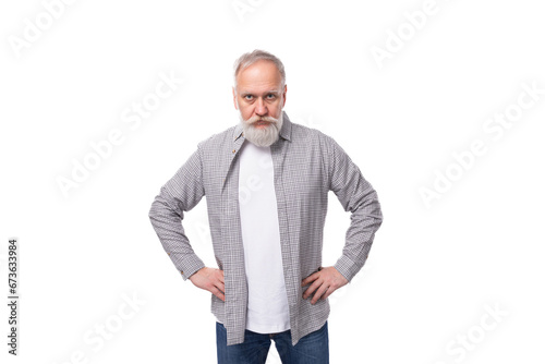 handsome mature man with white beard and mustache dressed in casual comfortable shirt and t-shirt