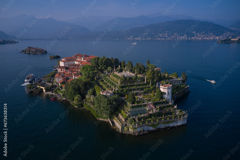 Aerial panoramic view of Isola Bella drone panoramic view. Borromean Islands, Lake Maggiore, Piedmont, Europe. Panorama at sunset on Lake Maggiore top view. Lake Maggiore, island, Isola Bella, Italy.