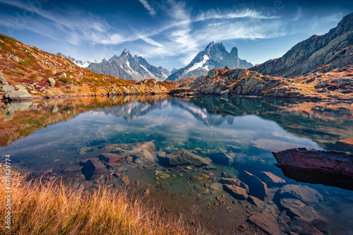 Superb autumn view of Chesery lake/Lac De Cheserys, Chamonix location. Spectacular morning scene of Vallon de Berard Nature Preserve, Graian Alps, France. Beauty of nature concept background..