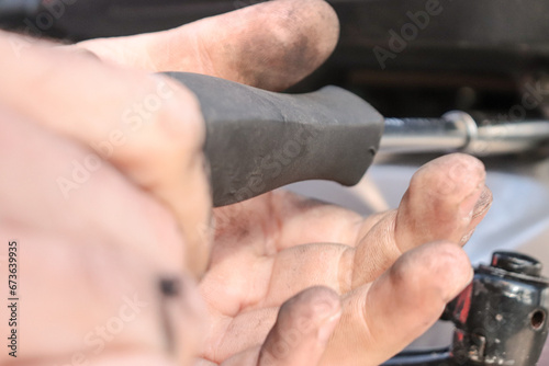 Close-up of a Mechanic s Dirty Hands