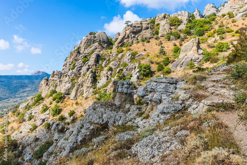 Mysterious mountain landscape of the Valley of Ghosts on the western slope of Mount Demerdzhi in Crimea. Popular tourism and trekking destination © dadamira
