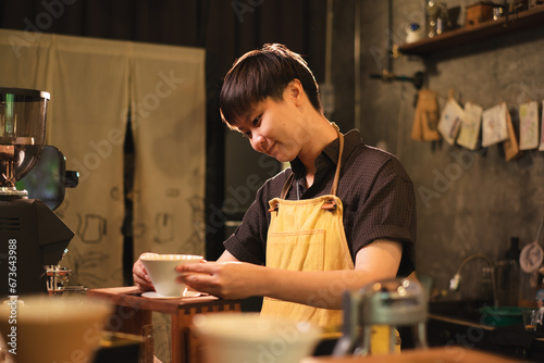 Female Barista is prepare filter coffee equipment in loft coffee shop or cafe bar. Concept of slow bar, pouring coffee caffeine, traditional making process of coffee maker. Black and brown style.