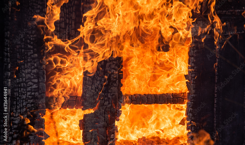 Blaze fire flame home. Burning wooden house. House fire. Burning building. Open flames. Fire in