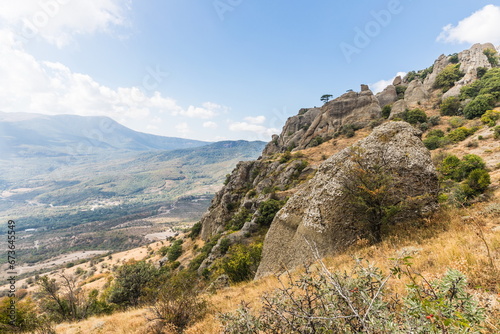 Mysterious mountain landscape of the Valley of Ghosts on the western slope of Mount Demerdzhi in Crimea. Popular tourism and trekking destination © dadamira